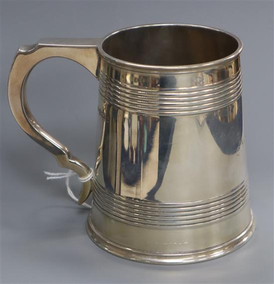A George V silver mug with reeded bands, Elkington & Co, Birmingham, 1913, 11 oz.